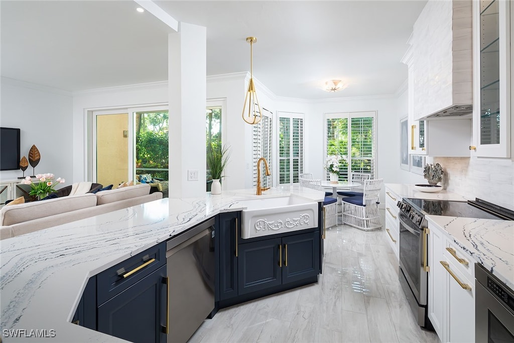 kitchen with ornamental molding, a sink, wall chimney range hood, stainless steel dishwasher, and range with electric stovetop