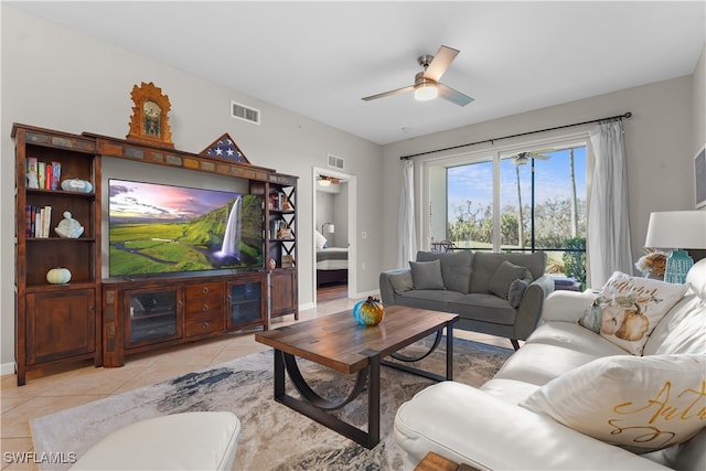 living room with light tile patterned floors and ceiling fan