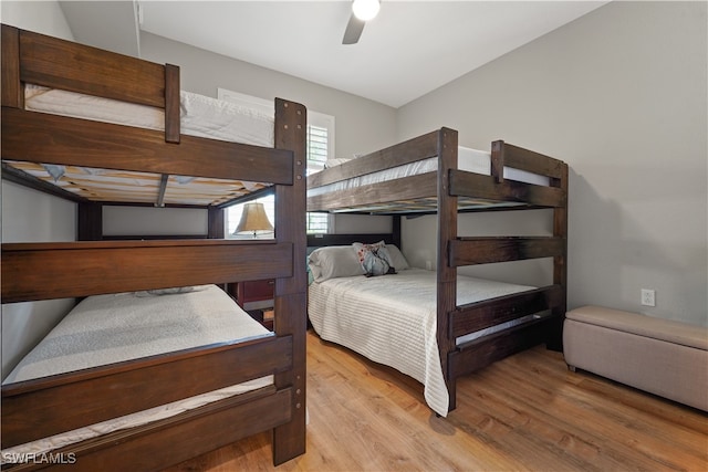 bedroom with ceiling fan and light hardwood / wood-style floors