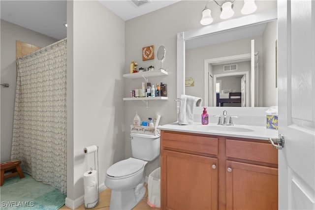 bathroom featuring tile patterned flooring, a shower with shower curtain, vanity, and toilet