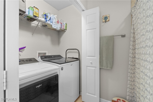 laundry room featuring washing machine and clothes dryer