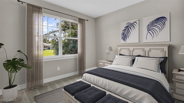 bedroom featuring light carpet