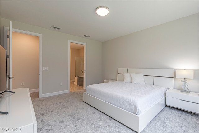 bedroom with light carpet