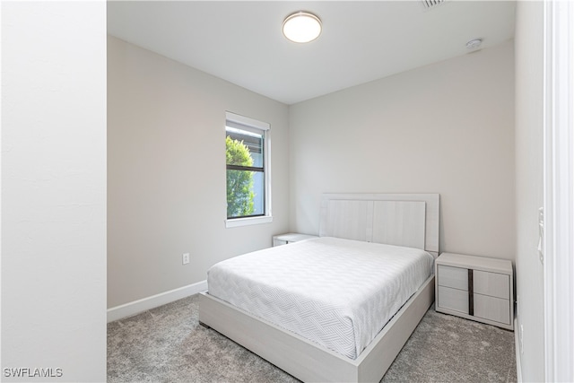 bedroom featuring carpet