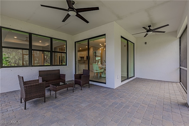 view of patio featuring ceiling fan