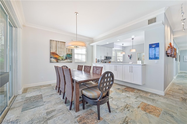 dining room with crown molding