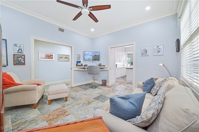 living room with ornamental molding and ceiling fan