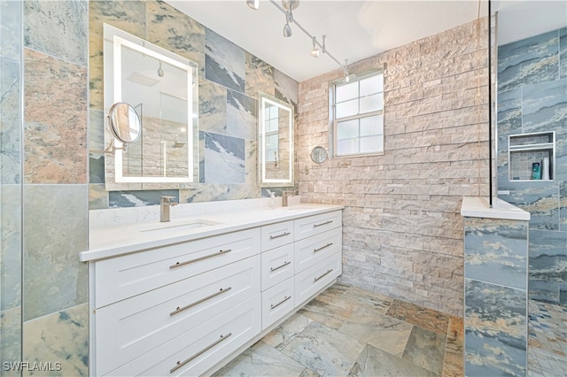 bathroom with tile walls and vanity