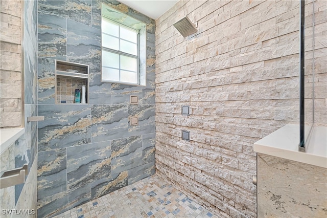 bathroom with tiled shower