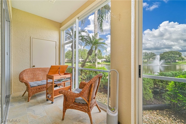 sunroom with a water view