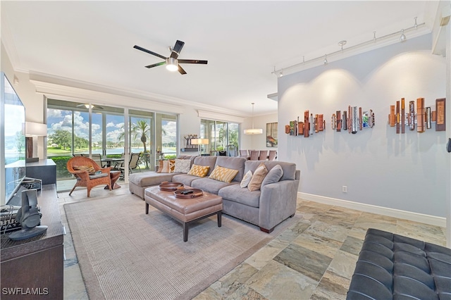 living room featuring ornamental molding, a healthy amount of sunlight, ceiling fan, and rail lighting