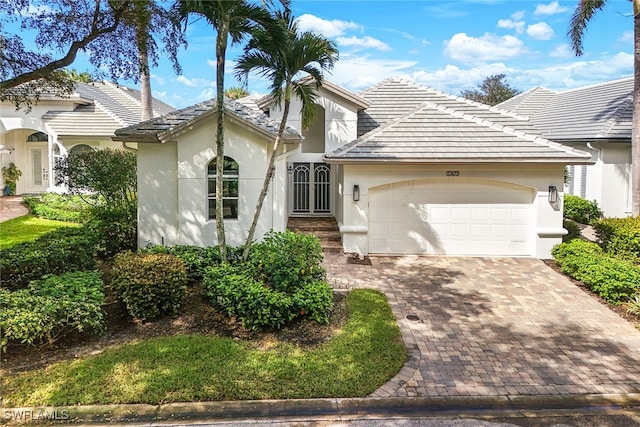 view of front of property with a garage