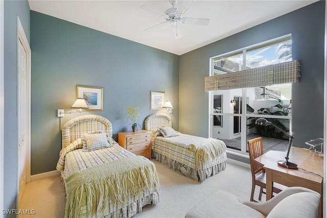 carpeted bedroom with a closet and ceiling fan