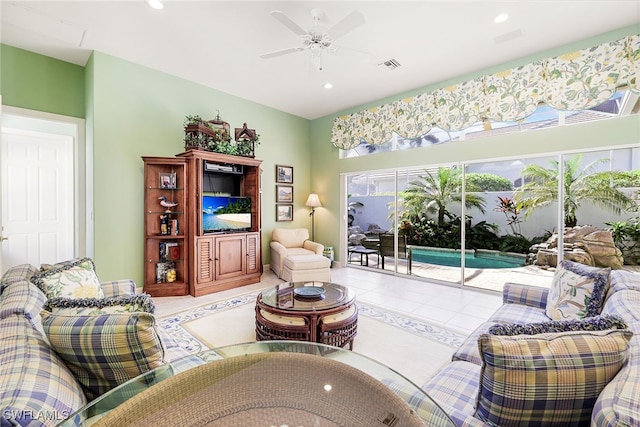 tiled living room with ceiling fan