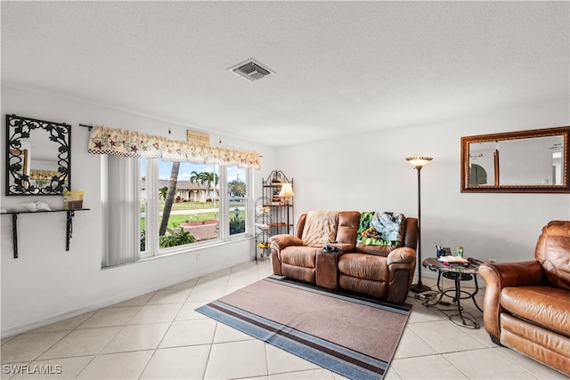 tiled living room with a textured ceiling