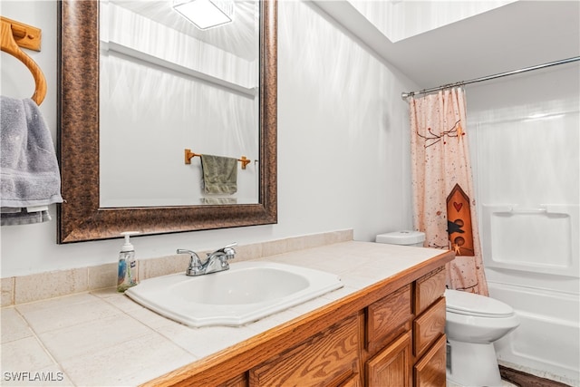 full bathroom with vanity, toilet, and shower / bath combo