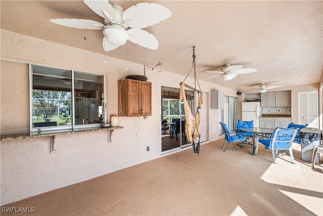 view of patio / terrace featuring ceiling fan