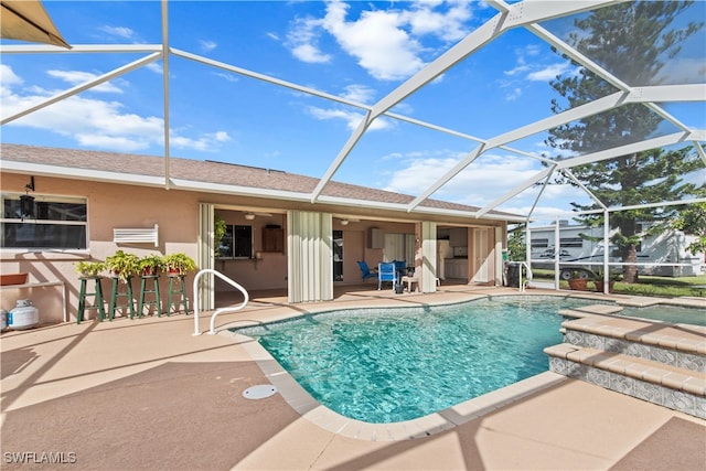 view of pool featuring a patio and glass enclosure