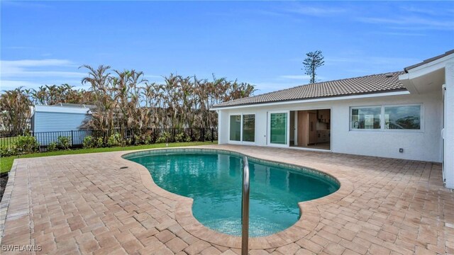 view of pool featuring a patio