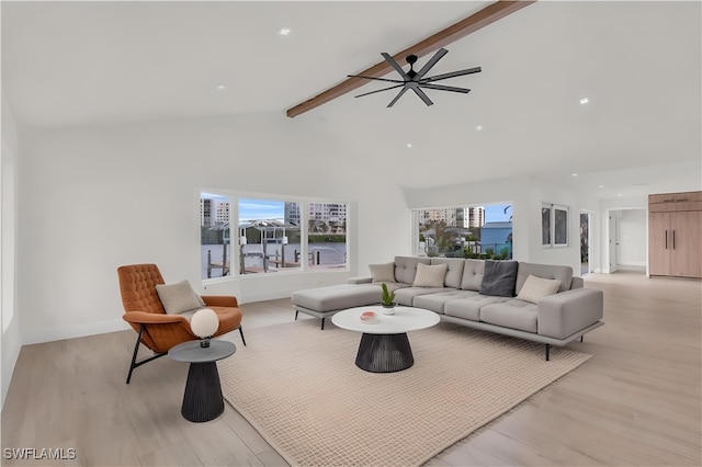 living room with baseboards, a ceiling fan, beamed ceiling, light wood-type flooring, and high vaulted ceiling