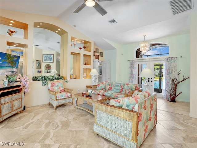 living room with ceiling fan with notable chandelier, vaulted ceiling, and french doors