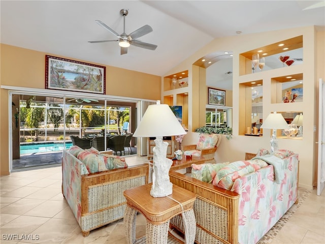 living room with vaulted ceiling, light tile patterned floors, and ceiling fan