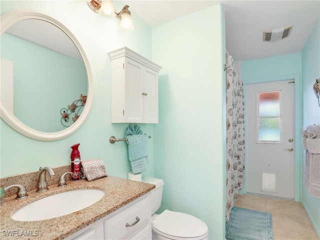 bathroom with toilet, tile patterned flooring, vanity, and a shower with shower curtain