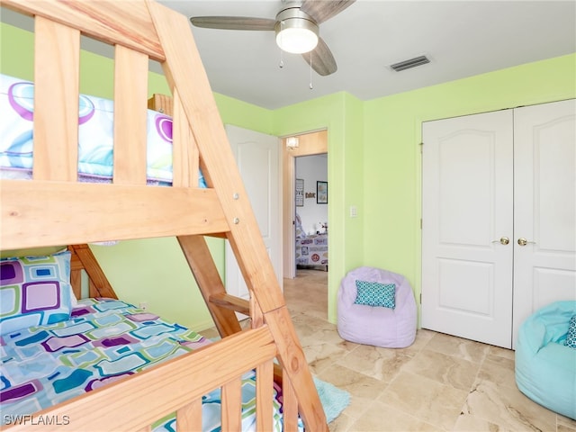 bedroom featuring a closet and ceiling fan