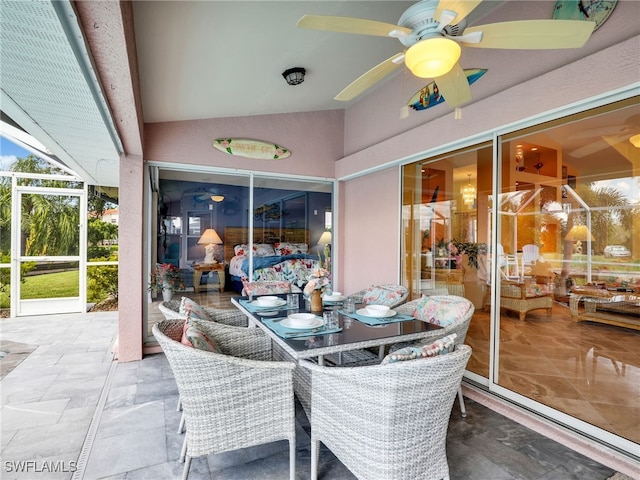 view of patio / terrace featuring ceiling fan and a lanai