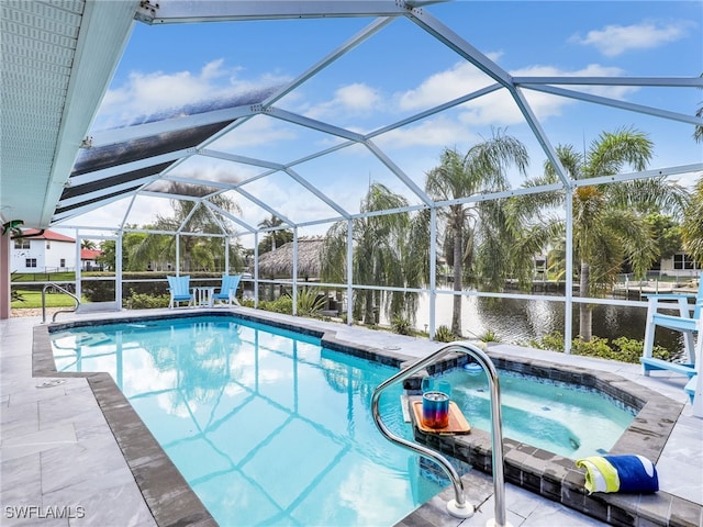 view of swimming pool with a lanai, a water view, a hot tub, and a patio area