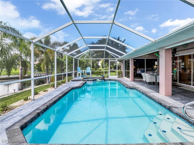 view of pool with a patio and a lanai