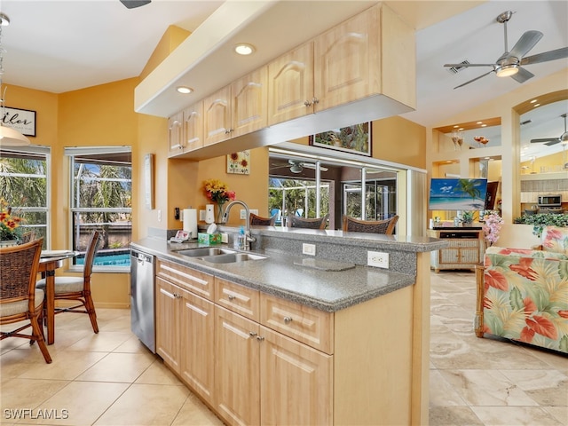 kitchen featuring light brown cabinets, stainless steel appliances, sink, and a healthy amount of sunlight