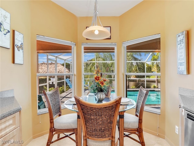 dining room featuring a healthy amount of sunlight and light tile patterned floors