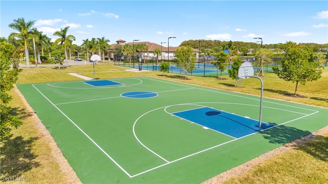 view of sport court with a yard and tennis court