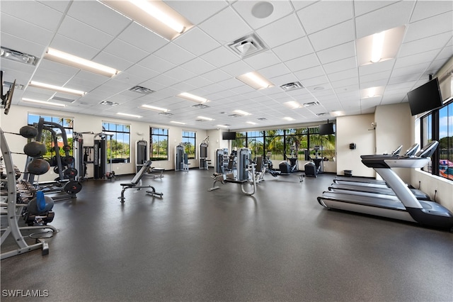 workout area featuring a drop ceiling