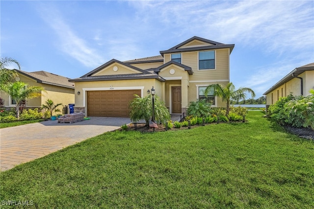 view of front facade with a front yard and a garage