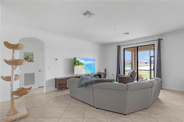 living room with crown molding and light tile patterned floors