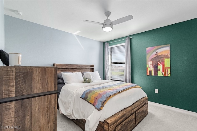 carpeted bedroom featuring ceiling fan