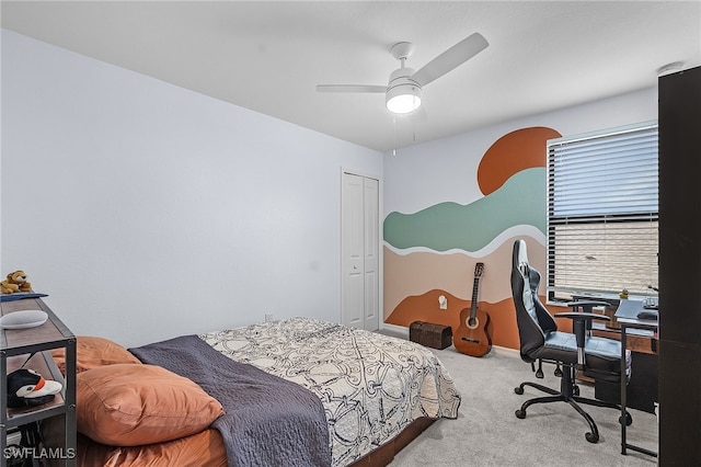 carpeted bedroom featuring a closet and ceiling fan