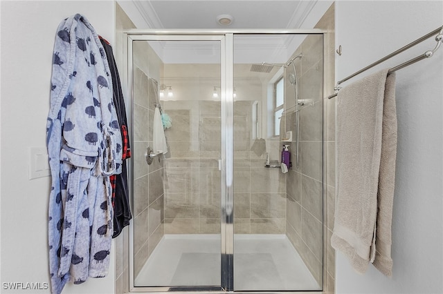 bathroom featuring crown molding and walk in shower