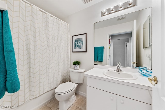 full bathroom featuring tile patterned floors, shower / bath combo, vanity, and toilet