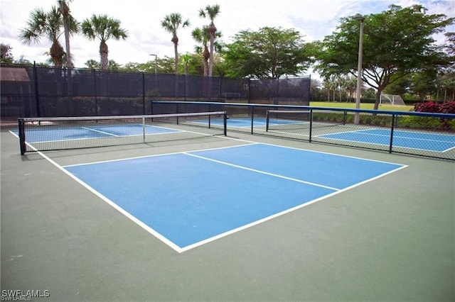 view of sport court featuring basketball hoop