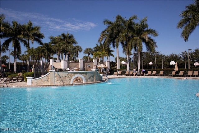 view of pool with pool water feature