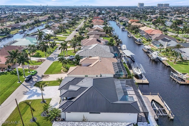 aerial view with a water view and a residential view