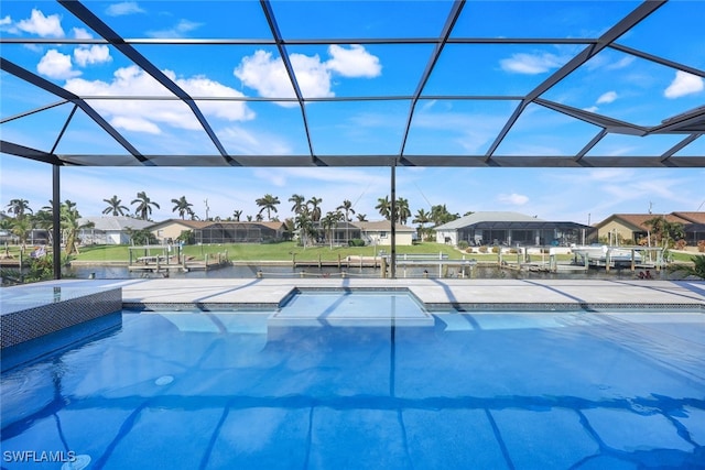 view of pool with a lanai and a residential view