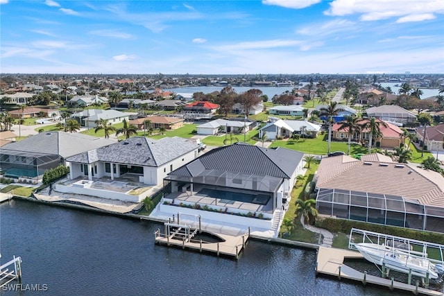 aerial view with a water view and a residential view