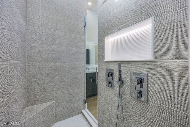 bathroom with vanity and a walk in shower