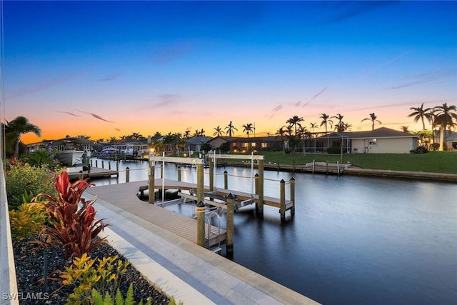 dock area featuring a residential view, a water view, and boat lift