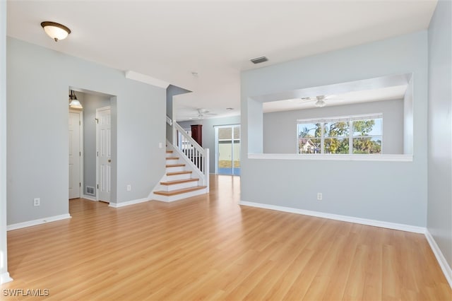 unfurnished room featuring ceiling fan and light wood-type flooring