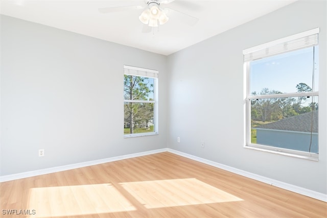 empty room featuring ceiling fan and wood-type flooring